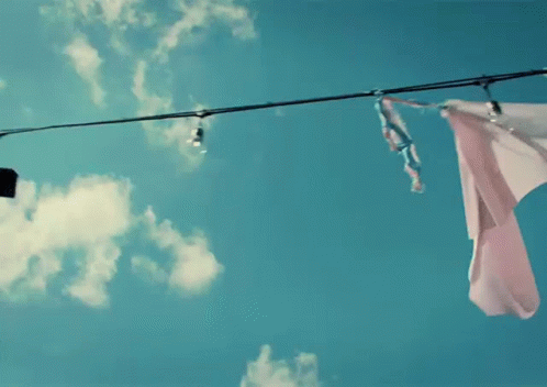 Banner Hanging On Clothesline GIF