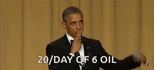 Barack Obama Is Giving A Speech In Front Of A Microphone While Covering His Mouth . GIF