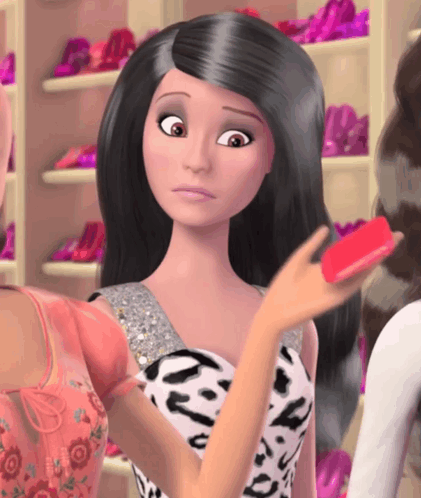 Barbie Doll Holding Red Object