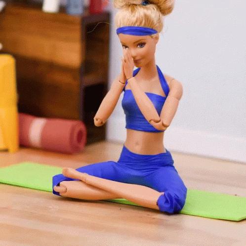 Barbie Doll on Green Yoga Mat