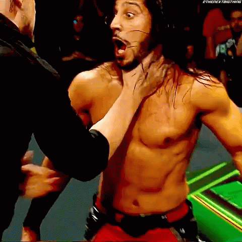 Baron Corbin Chokeslam Mustafa Ali On Announcers Table GIF
