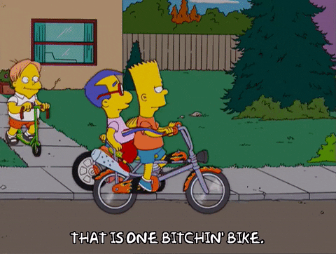 Bart Simpson Riding Bike On The Streets GIF