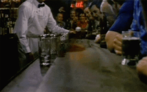 Bartender Serving Drink to Group