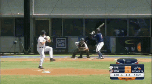Baseball Game in Front of Advertisement