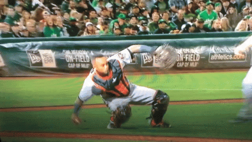 Baseball Game in Front of Banner