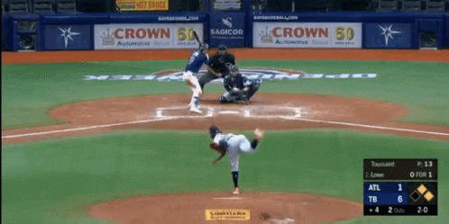 Baseball Game in Front of Crowd