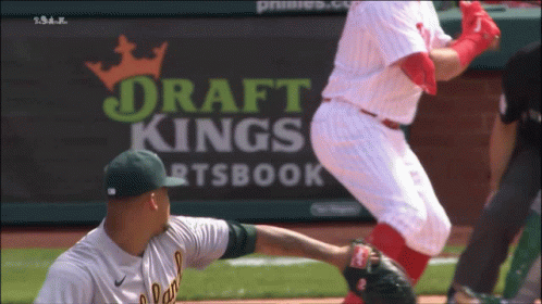 Baseball Game in Front of DraftKings Banner