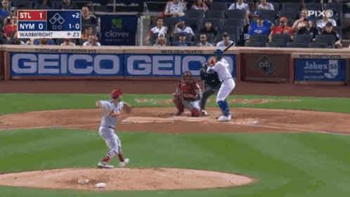 Baseball Game in Front of Geico Banner