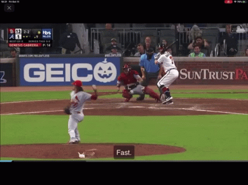 Baseball Game in Front of Geico Banner