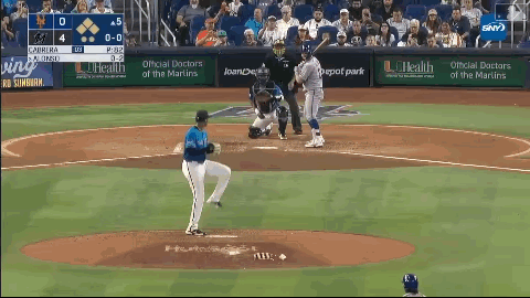 Baseball Game in Front of Loanche Bank Ad
