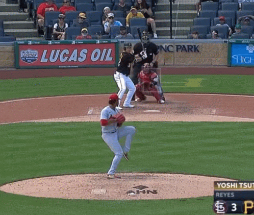 Baseball Game in Front of Lucas Oil Ad
