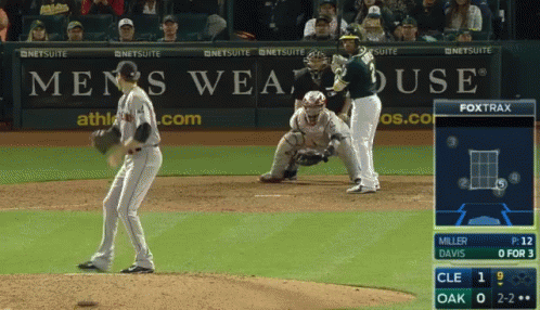 Baseball Game in Front of Men's Wearhouse Ad