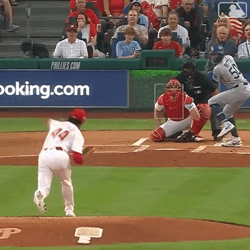 Baseball Game in Front of Phillies Advertisement