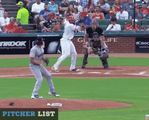 Baseball Game in Front of Pitcher List Sign