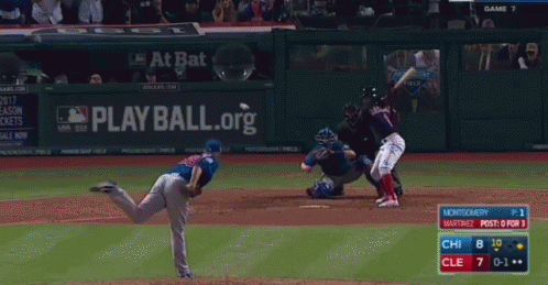 Baseball Game in Front of Play Ball Org Sign