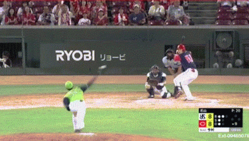 Baseball Game in Front of Ryobi Banner