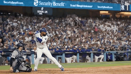 Baseball Game in Front of Security Benefit Sign