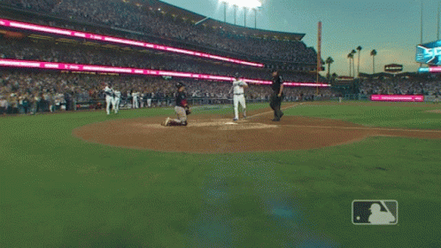 Baseball Game in Stadium with Scoreboard