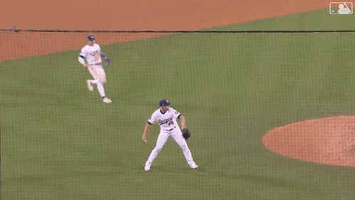 Baseball Game with Referee and Players
