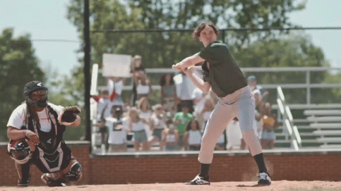 Baseball Player About to Hit With Catcher Behind