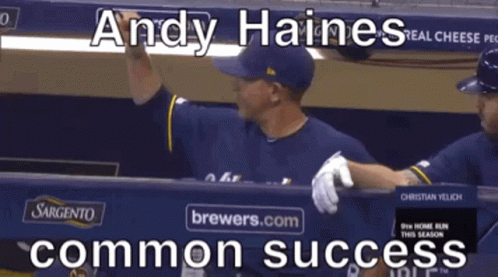 Baseball Player Andy Haines Standing in Dugout