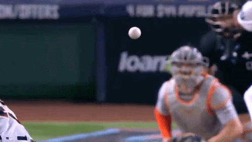 Baseball Player Catching Ball In Front Of Loan Sign GIF