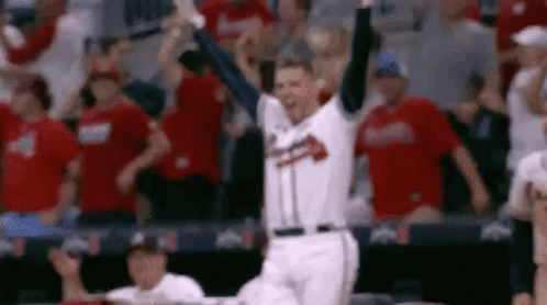 Baseball Player Celebrating Home Run in Front of Fans