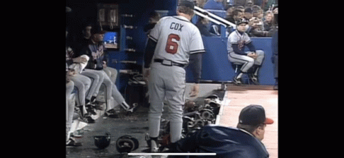 Baseball Player Cox Standing in Dugout