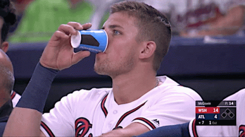 Baseball Player Drinking from Cup