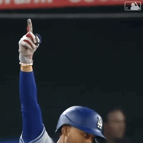 Baseball Player Holding Glove in Dodgers Helmet