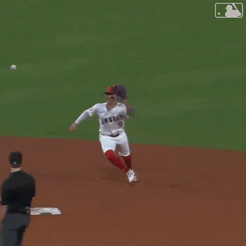 Baseball Player in Angels Jersey Standing on Base