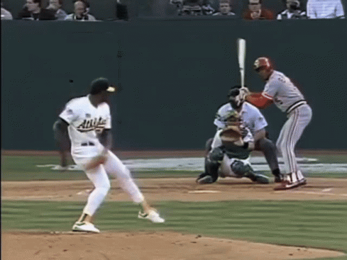 Baseball Player in Angels Jersey Swinging Bat