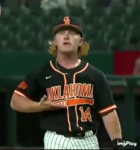 Baseball Player in Black and Orange Uniform on Field