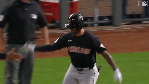 Baseball Player in Black Boston Jersey Running
