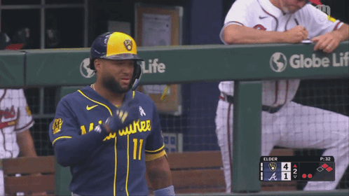 Baseball Player in Blue and Yellow Uniform Number 11