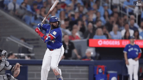 Baseball Player In Blue Jays Uniform Swinging Bat GIF