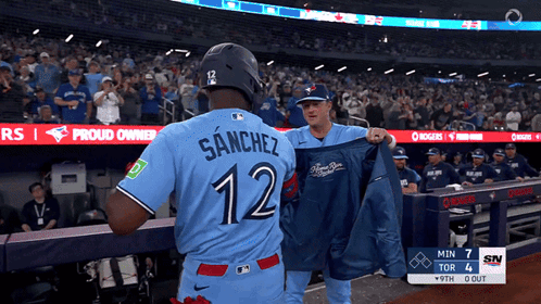 Baseball Player in Blue Jersey Number 12