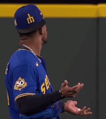 Baseball Player In Blue Jersey Number 50 GIF