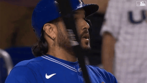Baseball Player In Blue Jersey With Letter U GIF