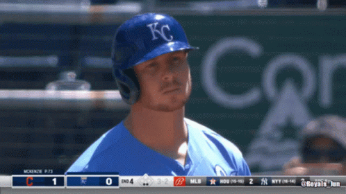 Baseball Player in Blue KC Hat at Scoreboard