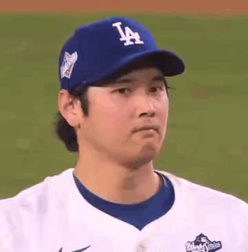 Baseball Player in Blue LA Hat and White Jersey