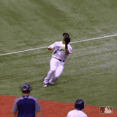 Baseball Player in Braves Shirt Sliding Into Home Plate