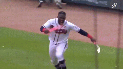 Baseball Player in Braves Uniform Running