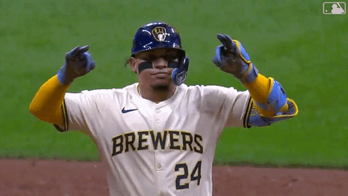 Baseball Player in Brewers Jersey and Gloves