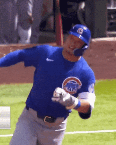 Baseball Player in Chicago Cubs Uniform Swinging Bat