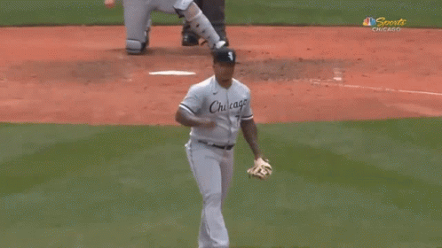 Baseball Player in Chicago Uniform Holding Glove