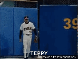 Baseball Player in Front of Blue Wall Saying Teppy