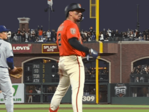 Baseball Player in Front of Levi's Sign