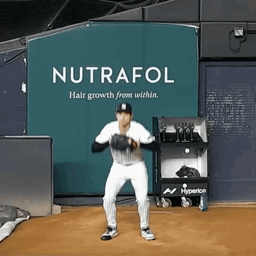 Baseball Player in Front of Nutrafol Sign