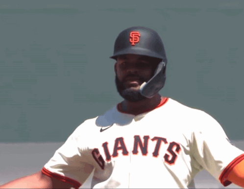 Baseball Player in Giants Jersey and Black Helmet